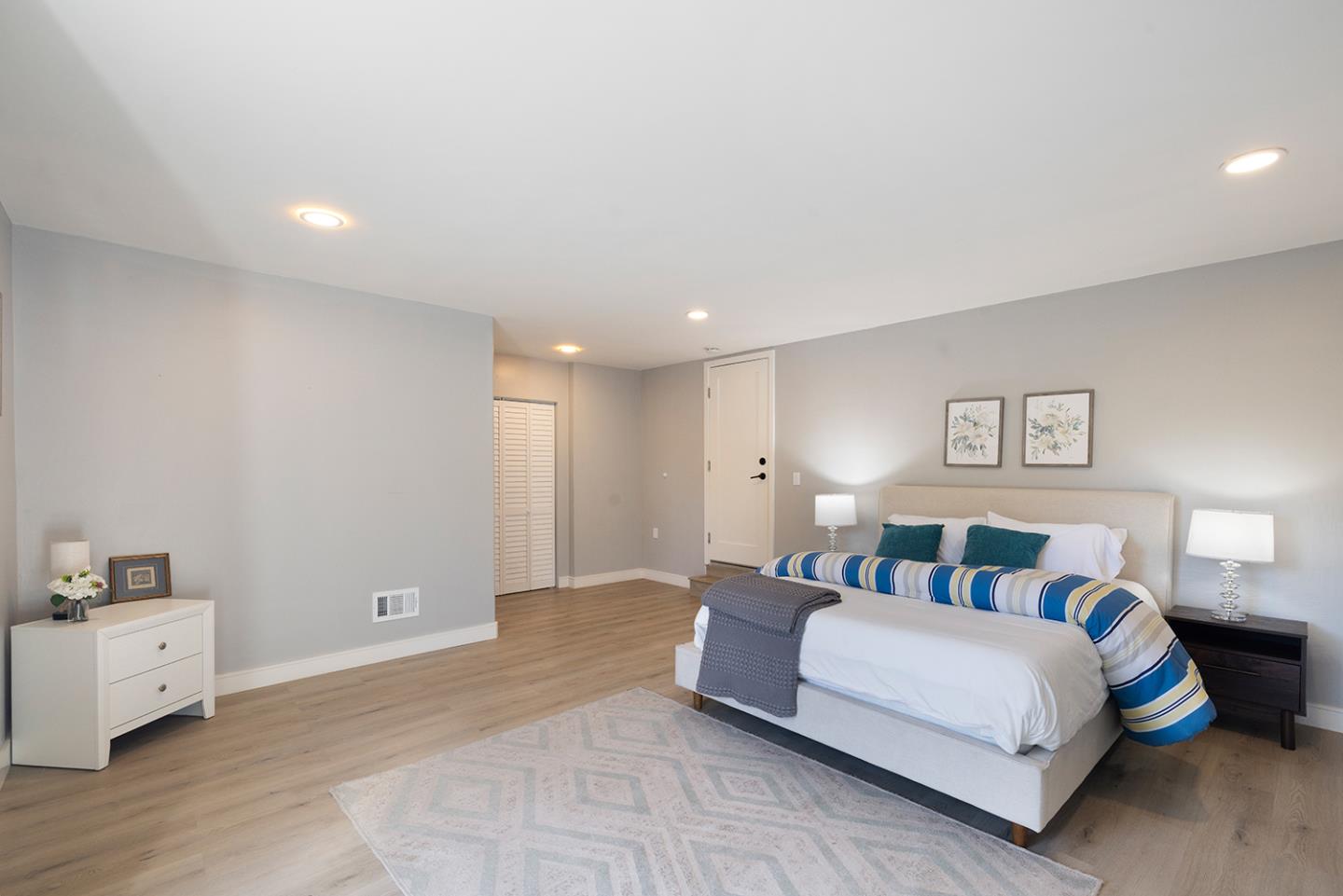 488 Monterey Road Pacifica, CA 94044 - Photo 62 of 78 a spacious bedroom with a bed and a view of room