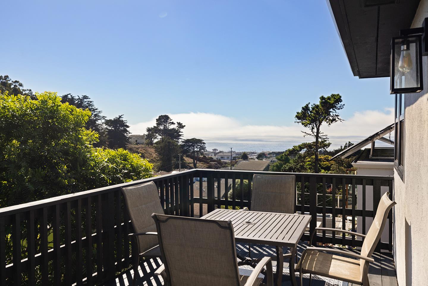 488 Monterey Road Pacifica, CA 94044 - Photo 65 of 78 a view of a balcony with wooden floor and outdoor seating