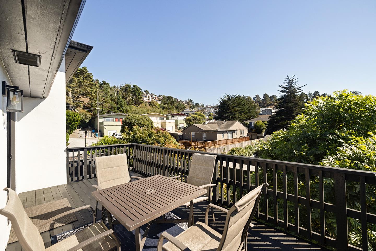 488 Monterey Road Pacifica, CA 94044 - Photo 68 of 78 a view of a balcony with wooden floor and outdoor seating