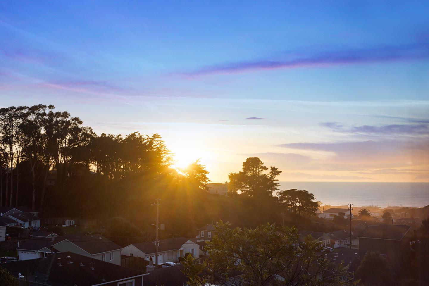 488 Monterey Road Pacifica, CA 94044 - Photo 7 of 78 a sunset view with a lake
