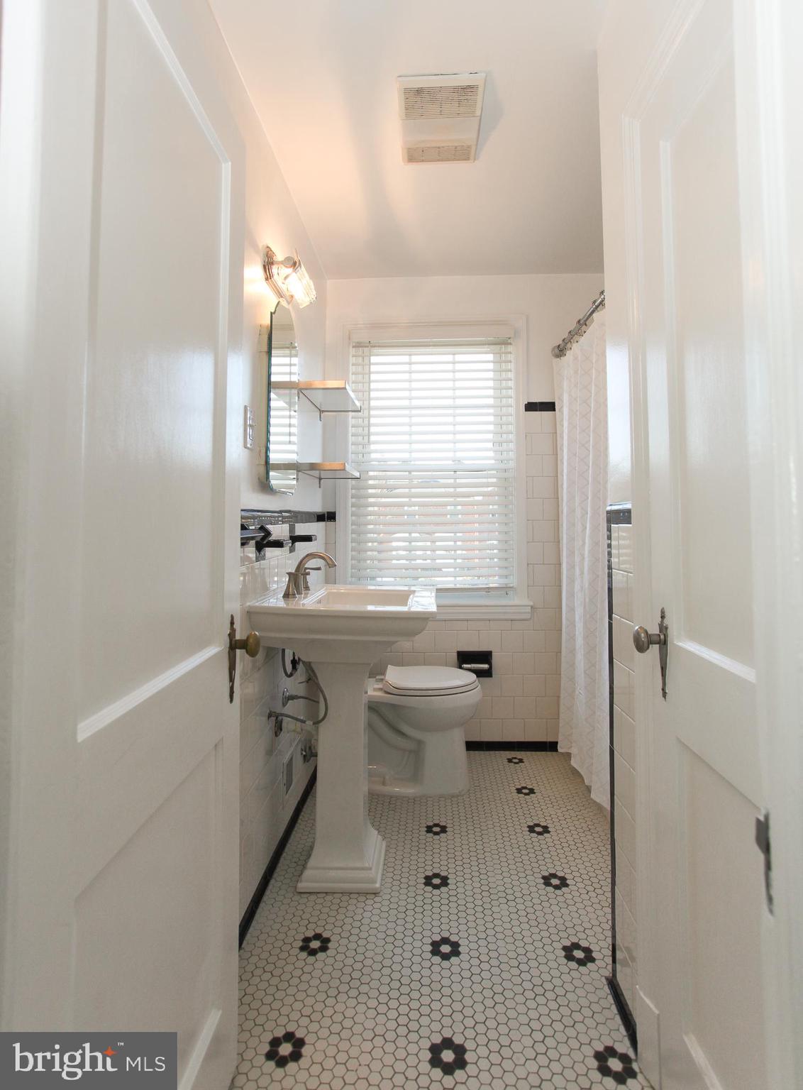 323 Greenlow Road Catonsville, MD 21228 - Photo 21 of 38 a bathroom with a sink toilet and shower