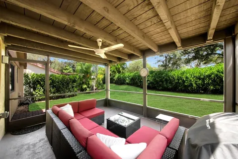 a view of a yard with furniture