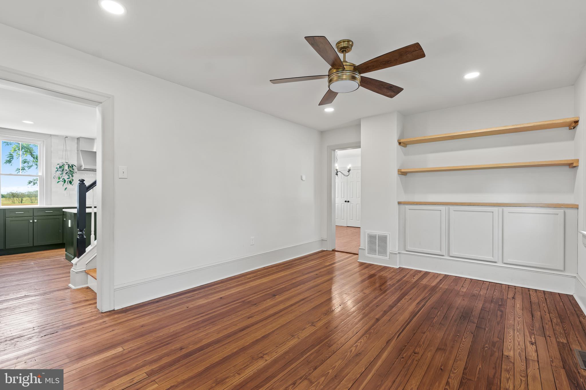 14005 Dry Run Road Clear Spring, MD 21722 - Photo 28 of 44 a view of an empty room with wooden floor and a ceiling fan