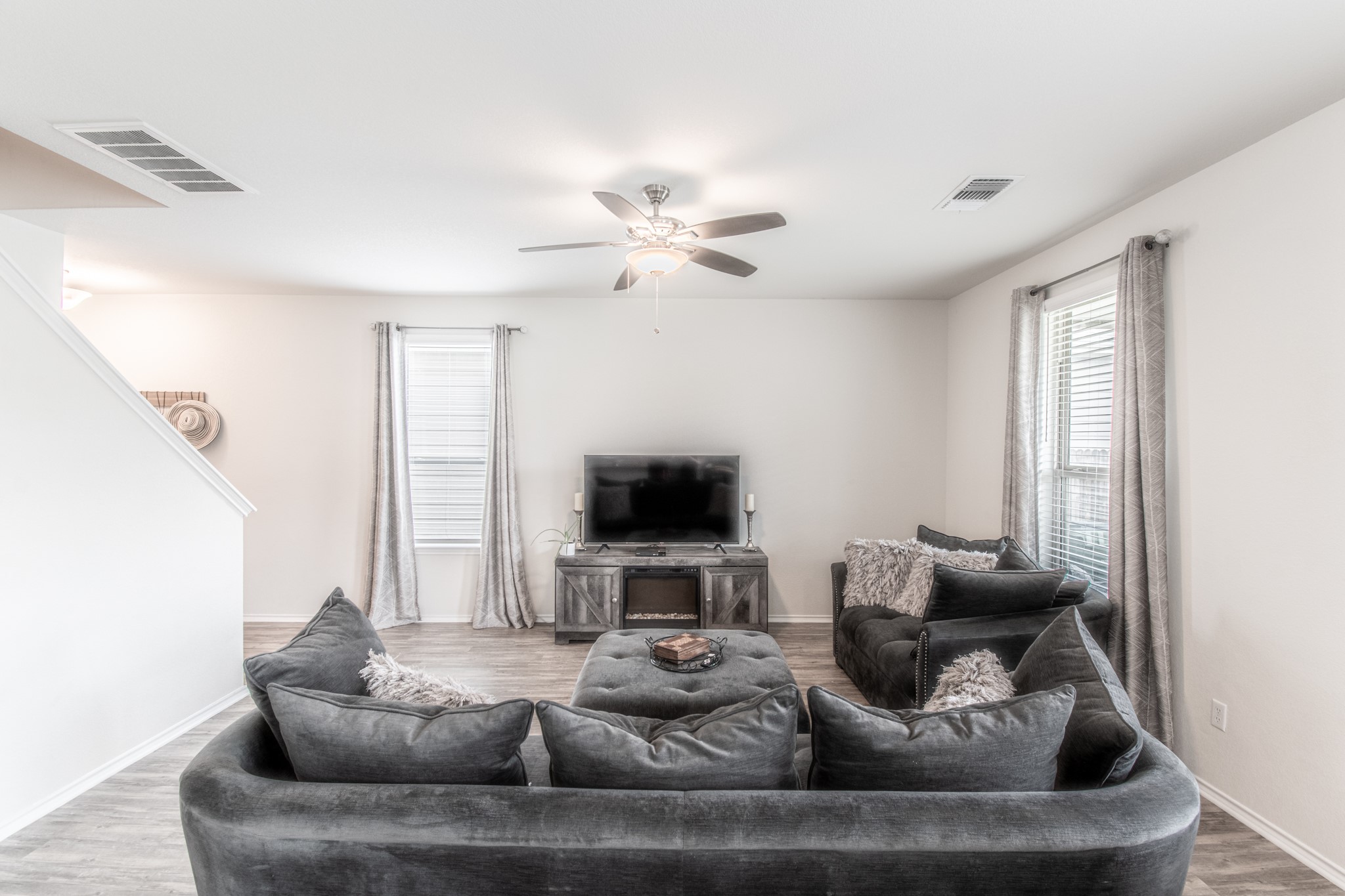 192 Spotted Rail Ridge Leander, TX 78641 - Photo 7 of 34 a living room with furniture and a flat screen tv