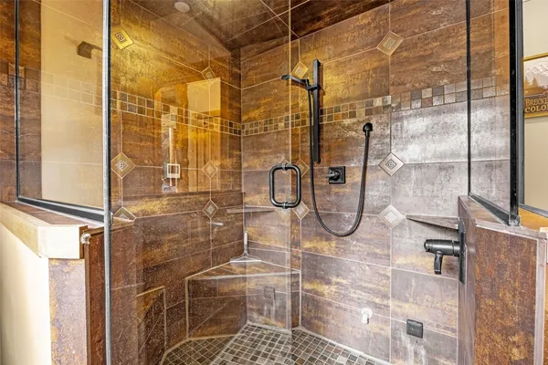 a bathroom with a glass shower door