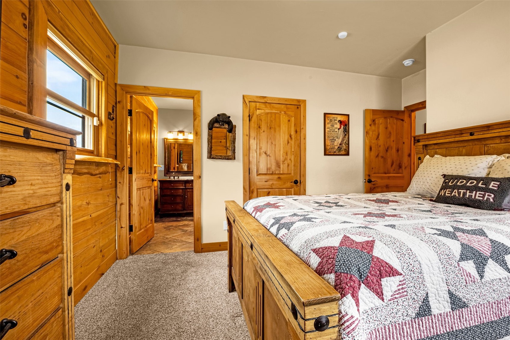 3418 High Creek Road Fairplay, CO 80440 - Photo 15 of 42 a bedroom with a bed and dresser with mirror