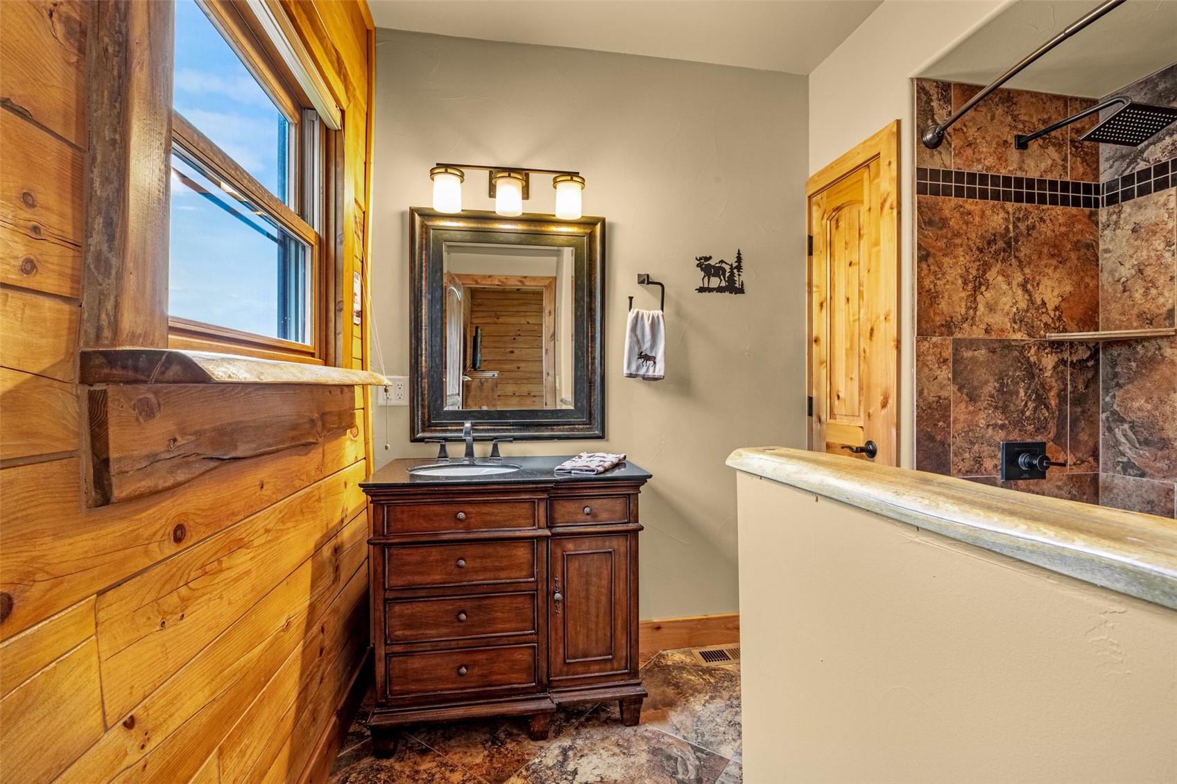 3418 High Creek Road Fairplay, CO 80440 - Photo 16 of 42 a bathroom with a sink and a mirror