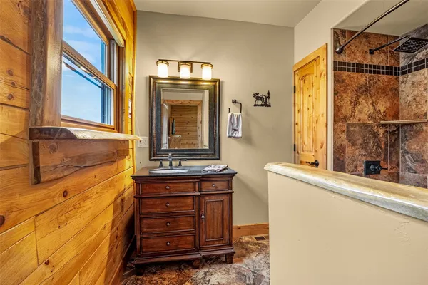 a bathroom with a sink and a mirror