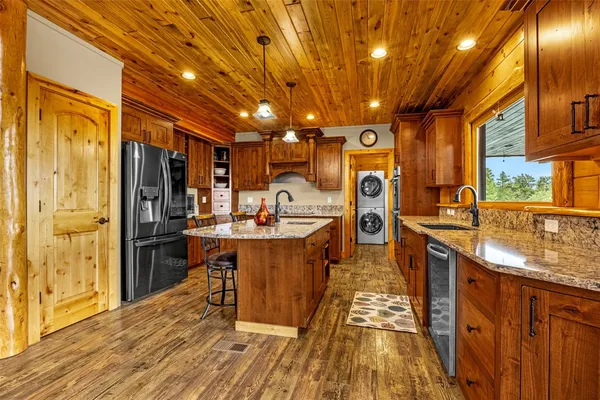 a very nice looking kitchen with a large window