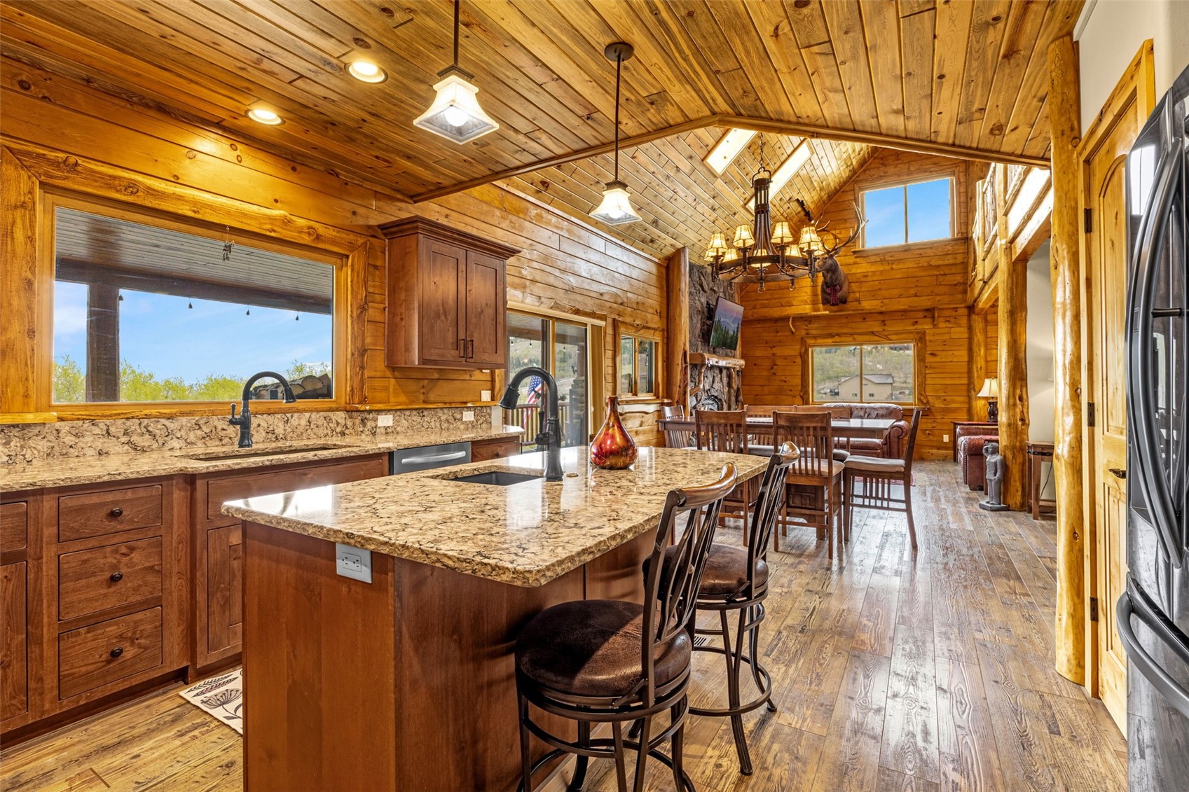 3418 High Creek Road Fairplay, CO 80440 - Photo 9 of 42 a view of a dining area with furniture and wooden floor