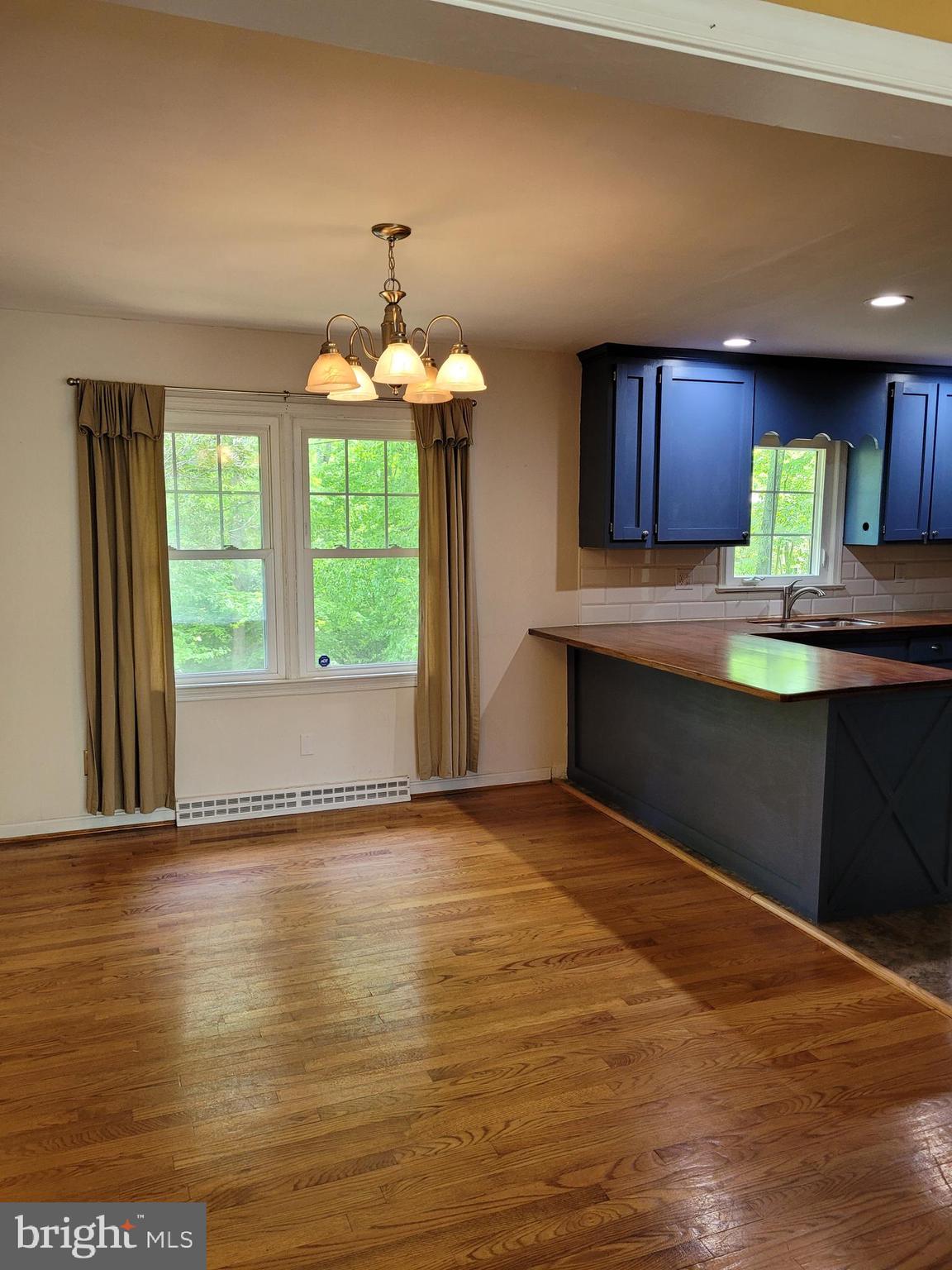 22820 Maple Road Lexington Park, MD 20653 - Photo 5 of 33 Dining room opens to kitchen bar