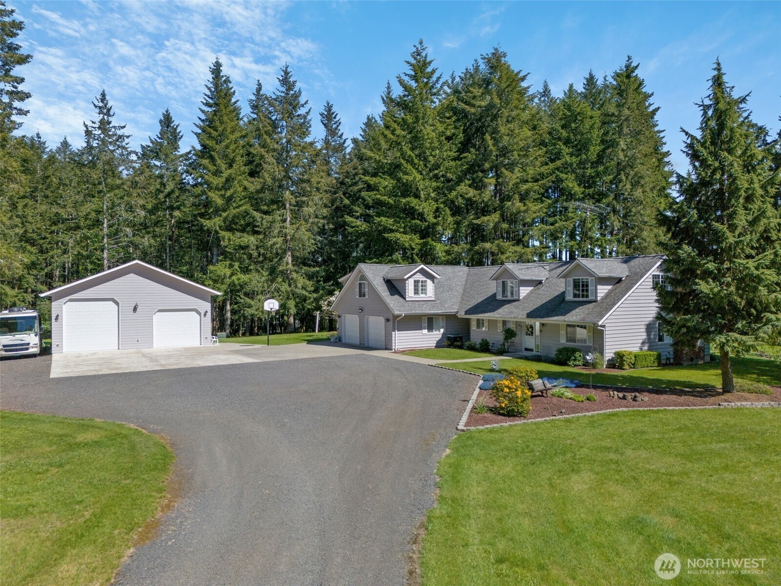 629 Brockway Road Chehalis, WA 98532 - Photo 5 of 40 a front view of a house with a yard and trees