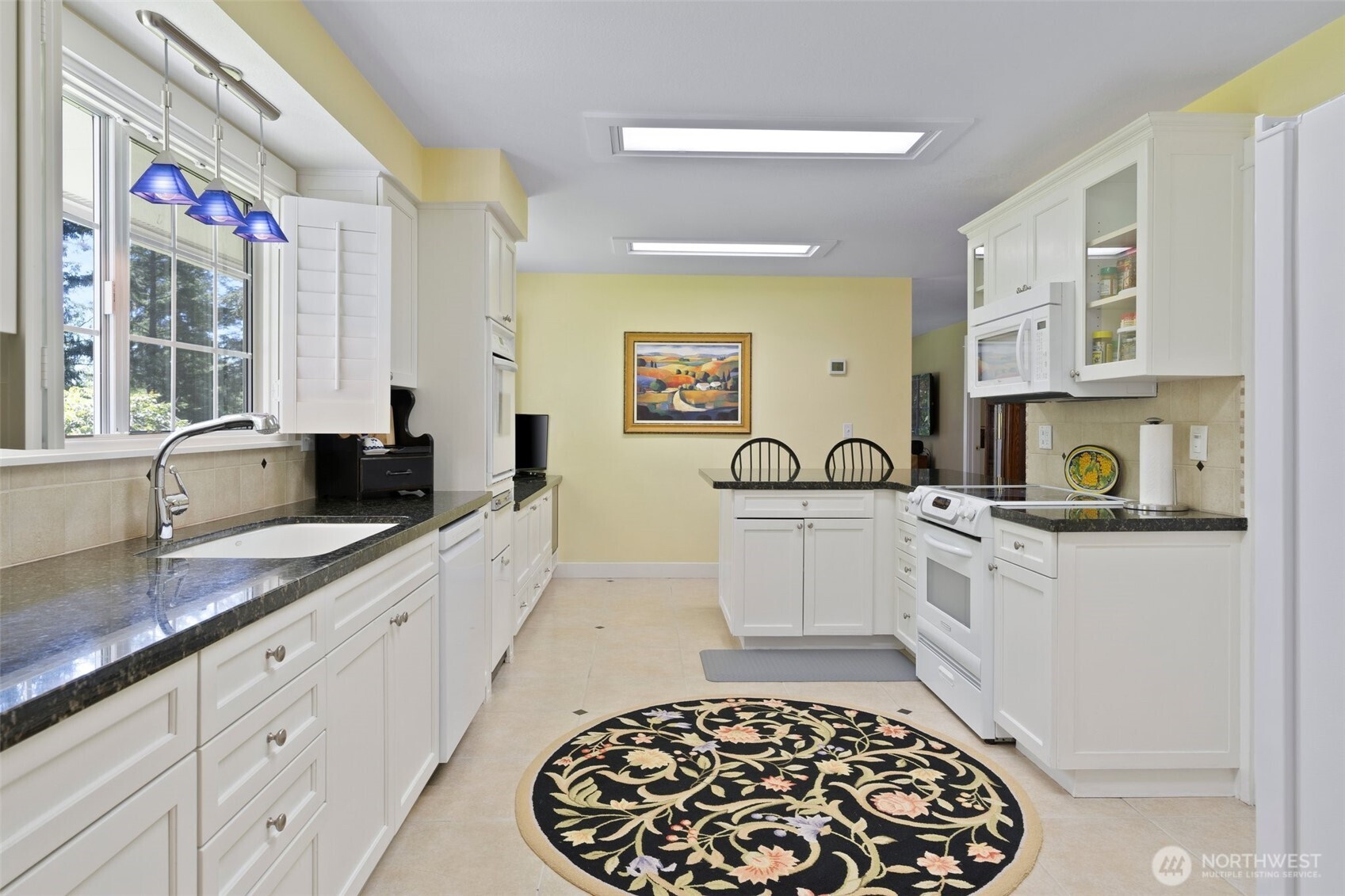 629 Brockway Road Chehalis, WA 98532 - Photo 7 of 40 a large white kitchen with stainless steel appliances a stove a sink and a microwave