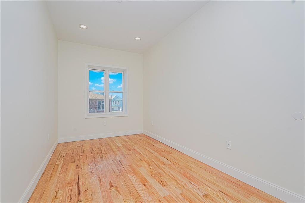 158 Bay 29th Street Brooklyn, NY 11214 - Photo 15 of 24 a view of a room with wooden floor and a window