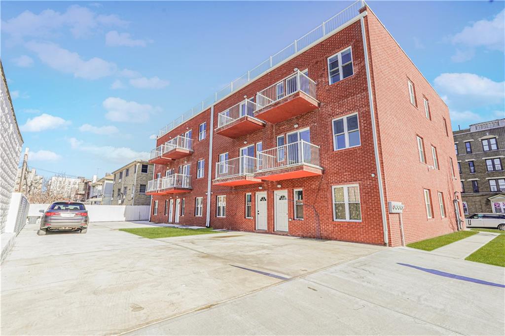 158 Bay 29th Street Brooklyn, NY 11214 - Photo 3 of 24 a front view of a building with cars parked