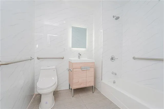 a bathroom with a toilet sink and bathtub