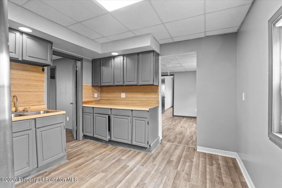 901 Eynon Street Scranton, PA 18504 - Photo 11 of 34 a kitchen with cabinets and wooden floor