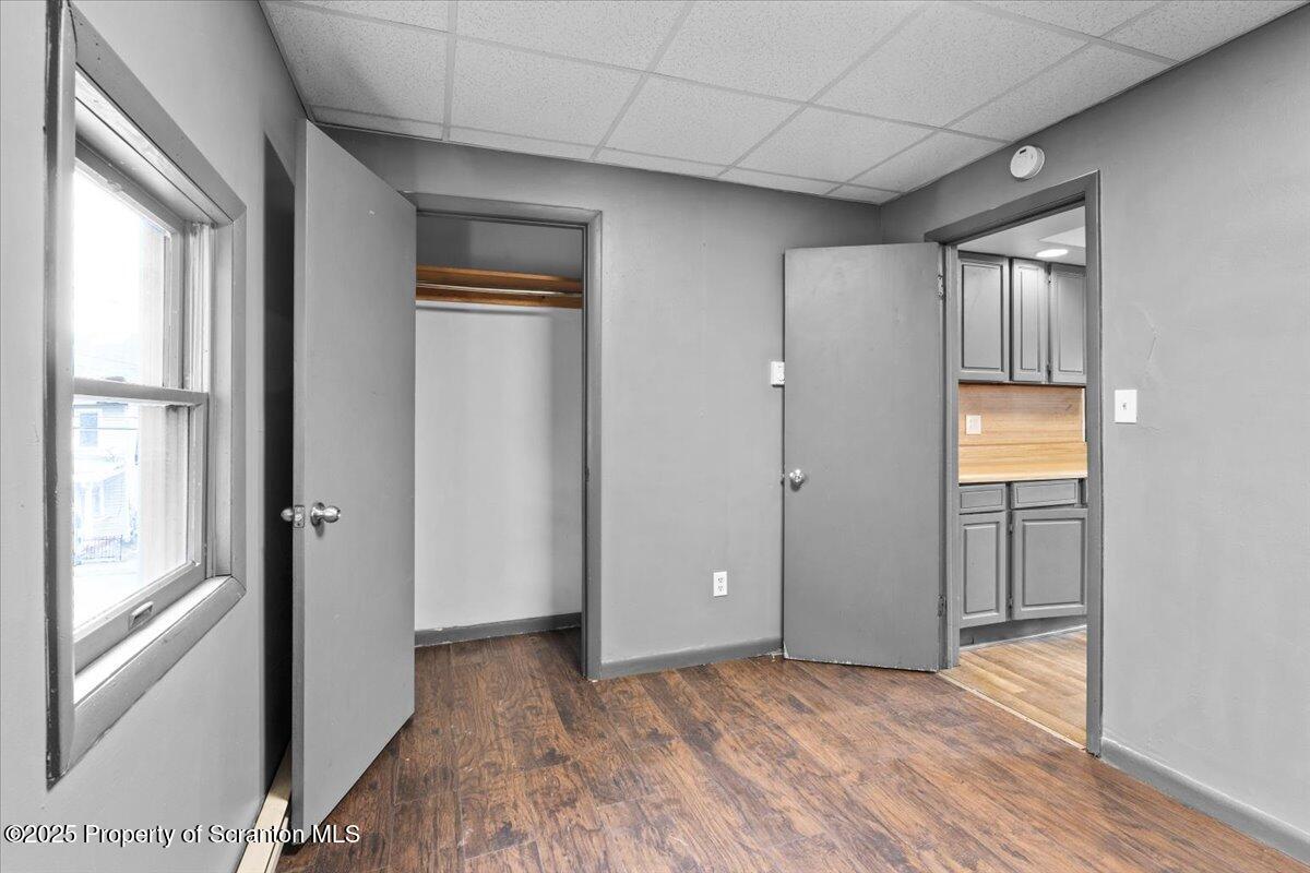 901 Eynon Street Scranton, PA 18504 - Photo 16 of 34 a view of empty room with wooden floor and fan