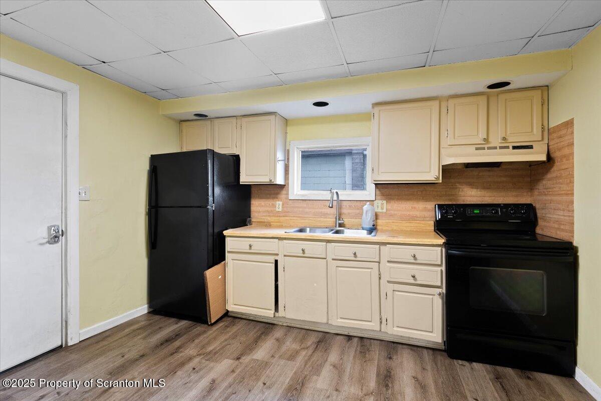 901 Eynon Street Scranton, PA 18504 - Photo 22 of 34 a kitchen with a refrigerator sink and cabinets