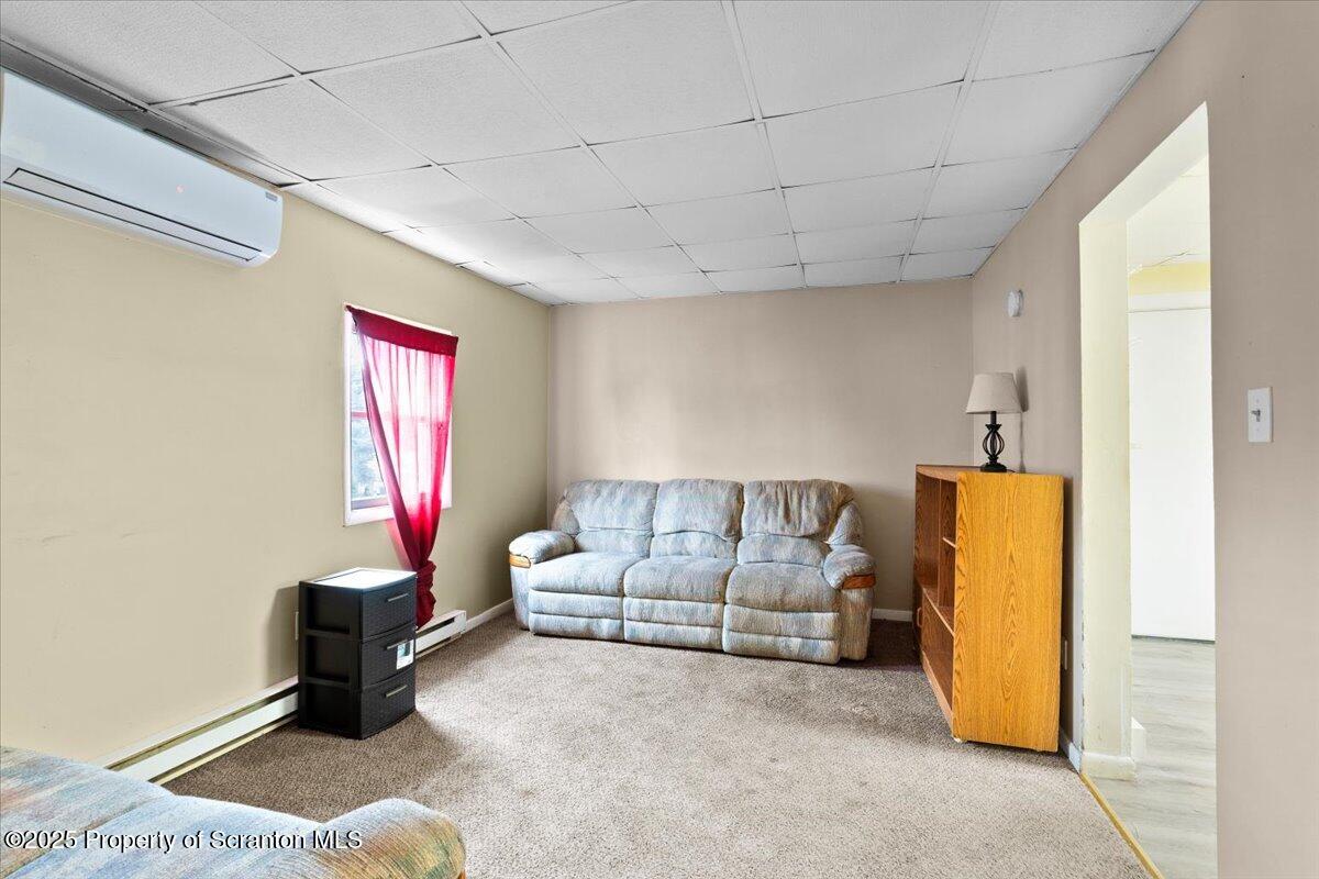 901 Eynon Street Scranton, PA 18504 - Photo 26 of 34 a living room with furniture and a window