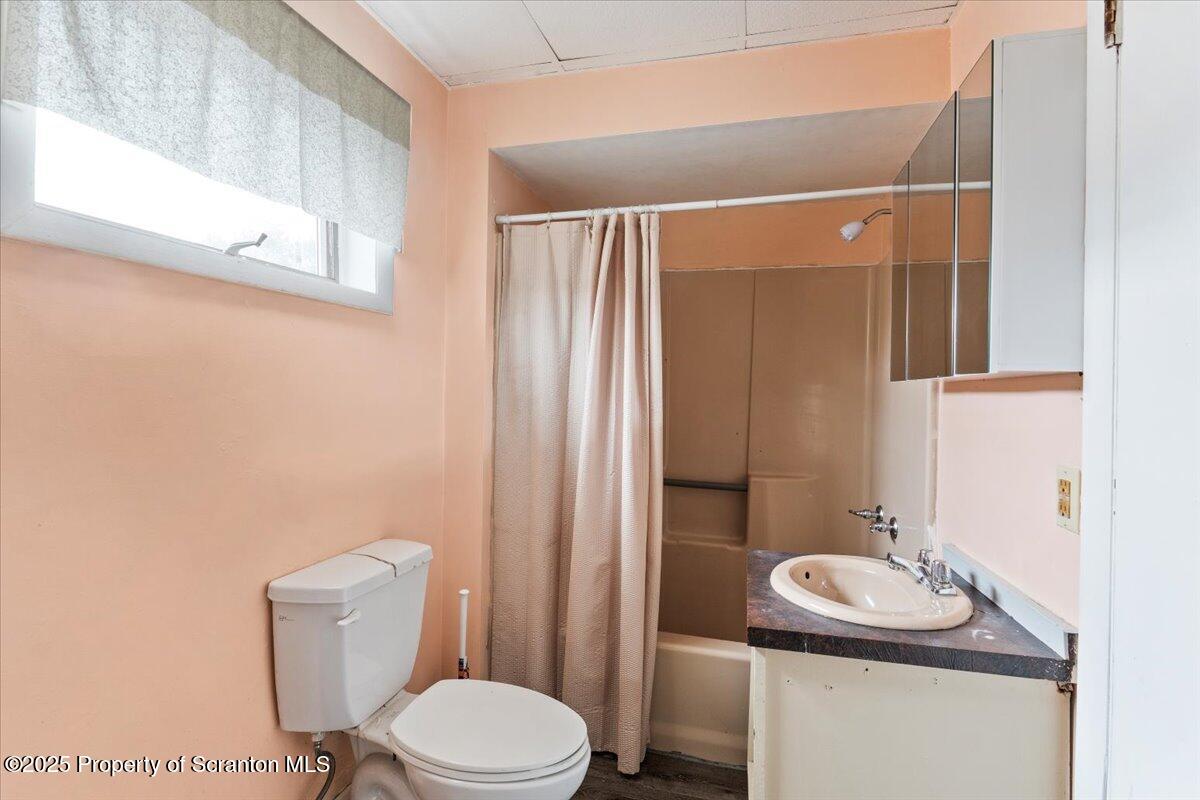 901 Eynon Street Scranton, PA 18504 - Photo 27 of 34 a bathroom with a sink toilet and mirror