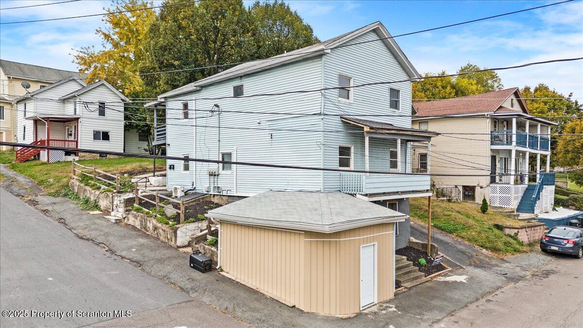 901 Eynon Street Scranton, PA 18504 - Photo 3 of 34 a backyard of a house with yard fire pit and outdoor seating