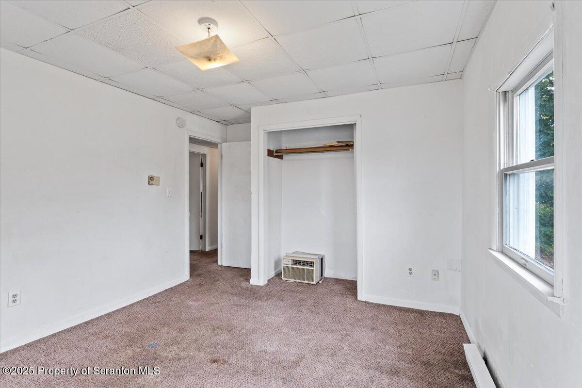 901 Eynon Street Scranton, PA 18504 - Photo 33 of 34 a view of a room with a ceiling fan and window