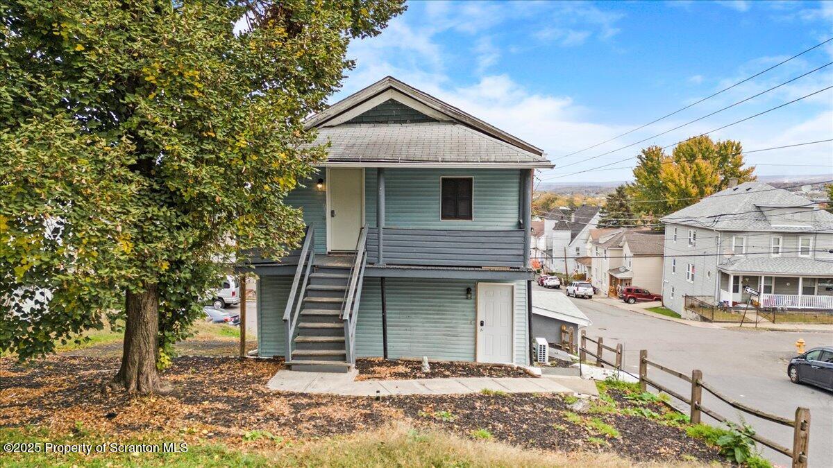 901 Eynon Street Scranton, PA 18504 - Photo 5 of 34 a front view of a house with a yard