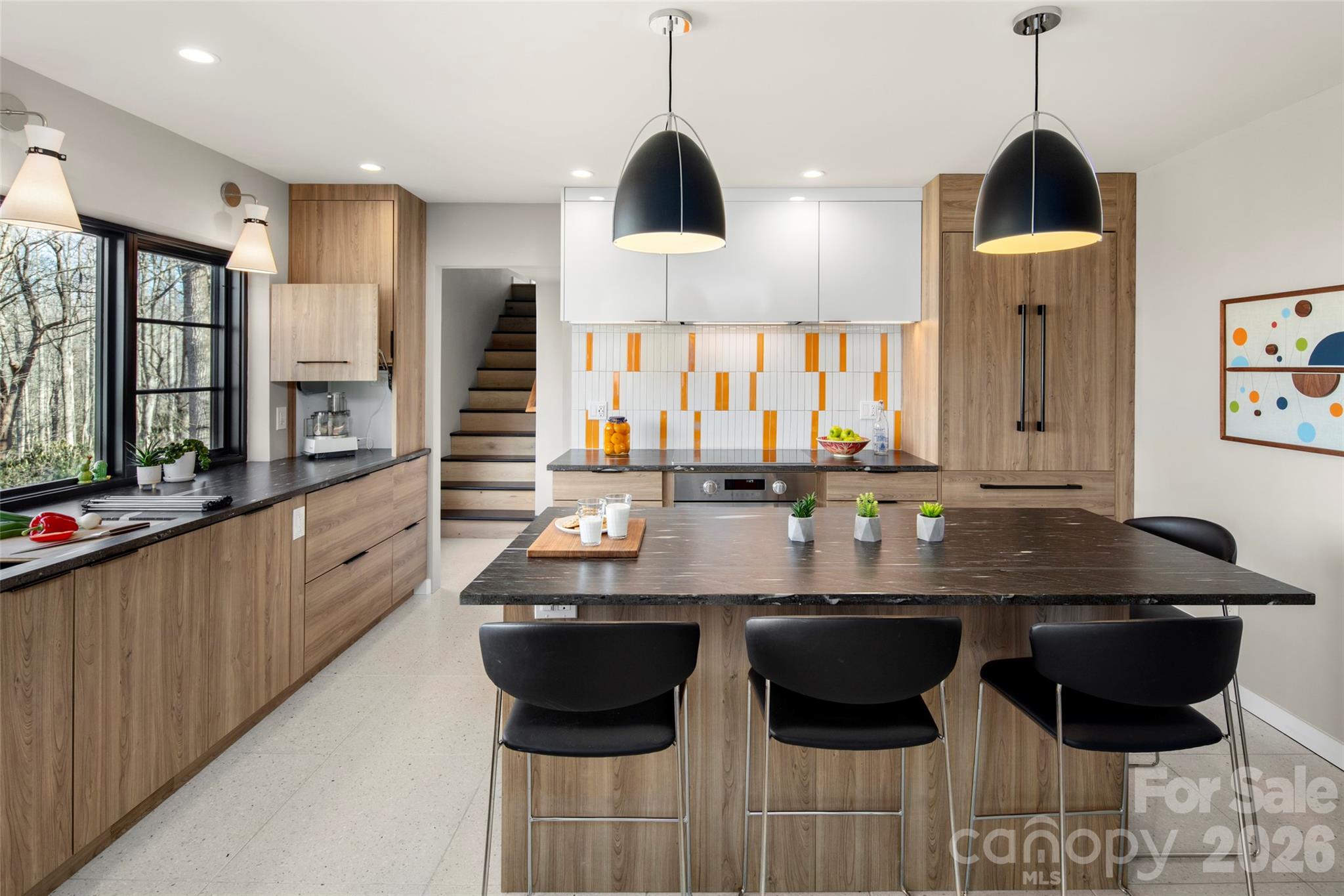 1202 Davis Mountain Road Hendersonville, NC 28739 - Photo 16 of 43 a kitchen with stainless steel appliances kitchen island granite countertop a sink and cabinets