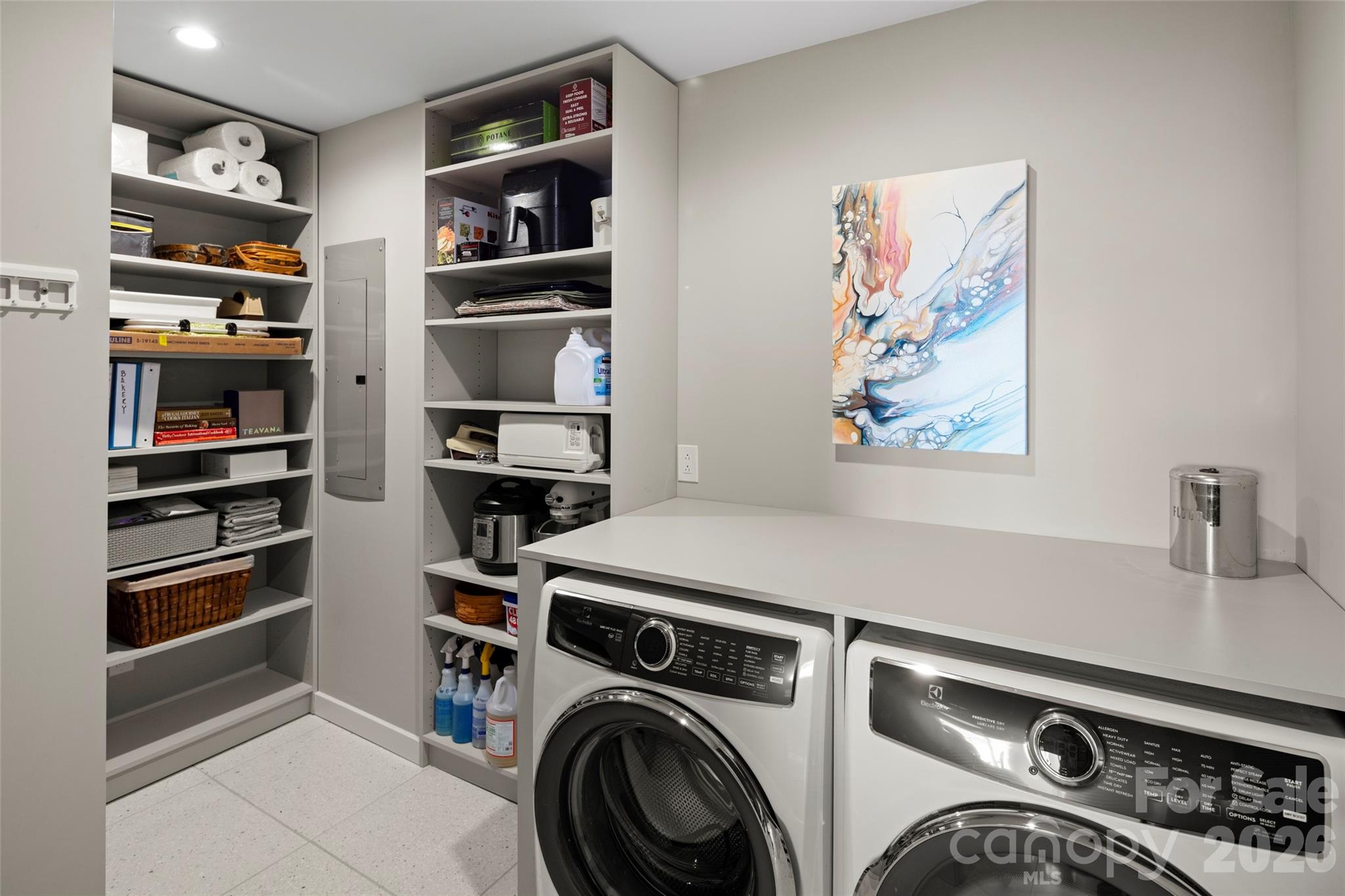 1202 Davis Mountain Road Hendersonville, NC 28739 - Photo 19 of 43 a view of a storage and utility room with washer and dryer