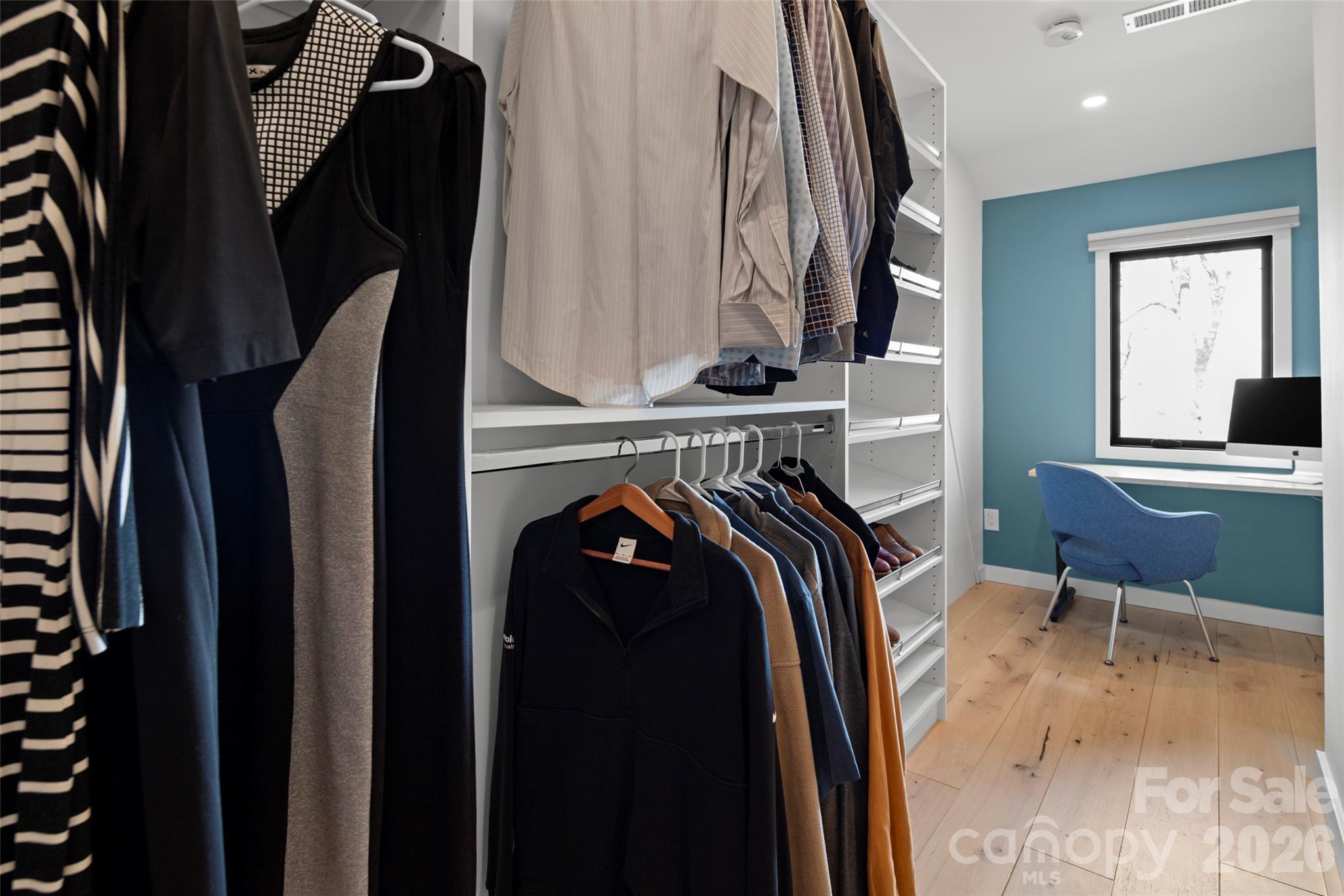 1202 Davis Mountain Road Hendersonville, NC 28739 - Photo 26 of 43 a view of walk in closet with clothes and shoes