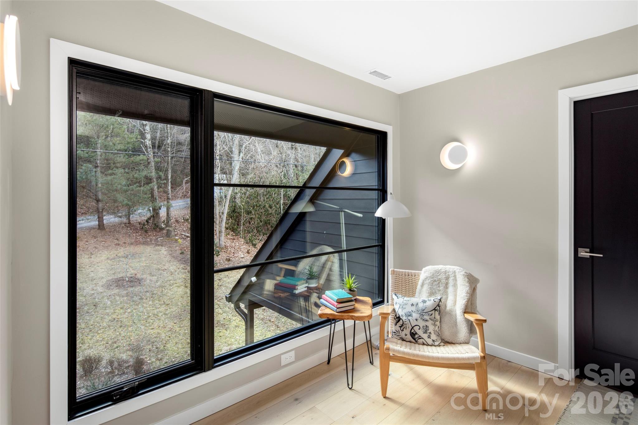 1202 Davis Mountain Road Hendersonville, NC 28739 - Photo 30 of 43 a living room with furniture and a window