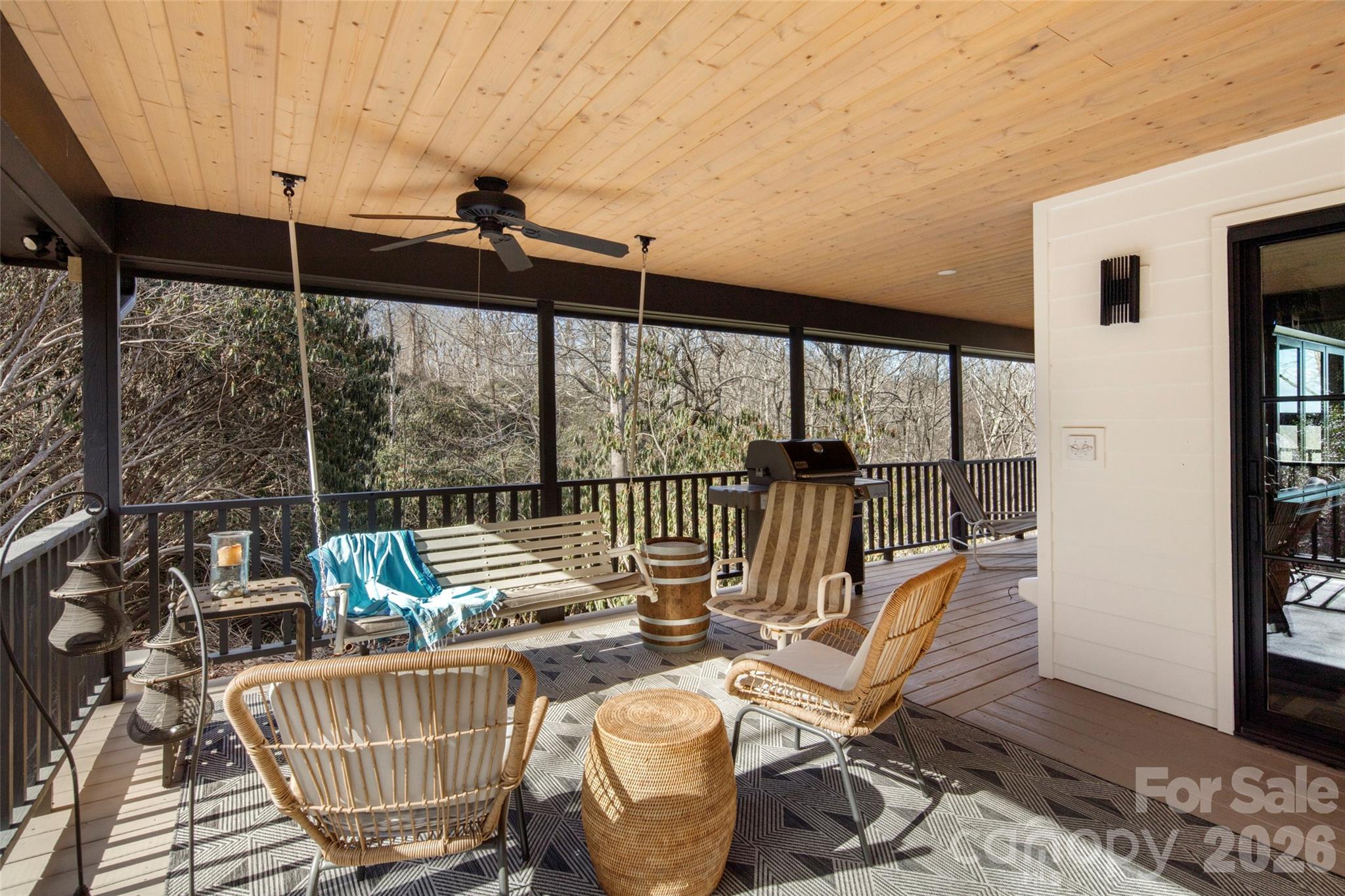 1202 Davis Mountain Road Hendersonville, NC 28739 - Photo 33 of 43 a balcony with furniture and wooden floor