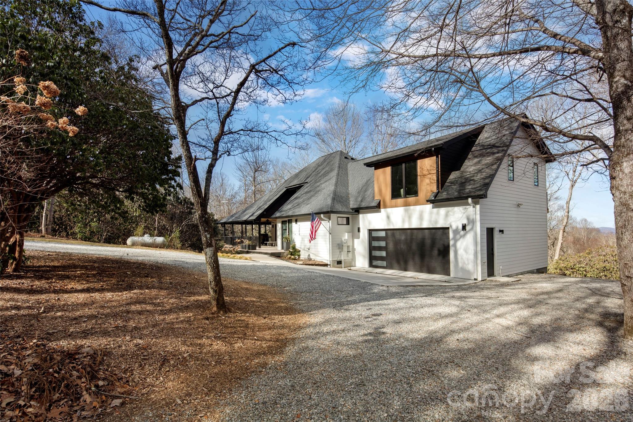 1202 Davis Mountain Road Hendersonville, NC 28739 - Photo 40 of 43 a view of a building with a tree