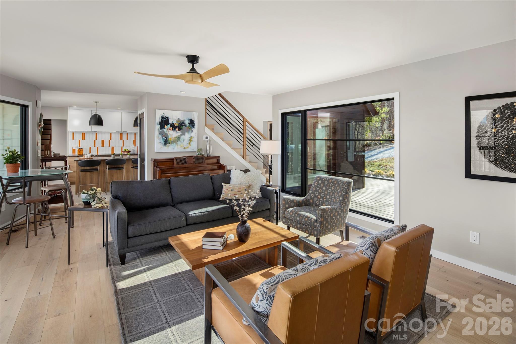1202 Davis Mountain Road Hendersonville, NC 28739 - Photo 8 of 43 a living room with furniture and wooden floor