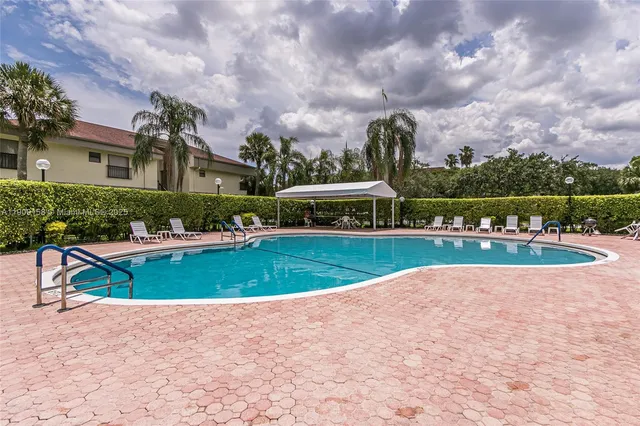 a outdoor space with swimming pool and furniture