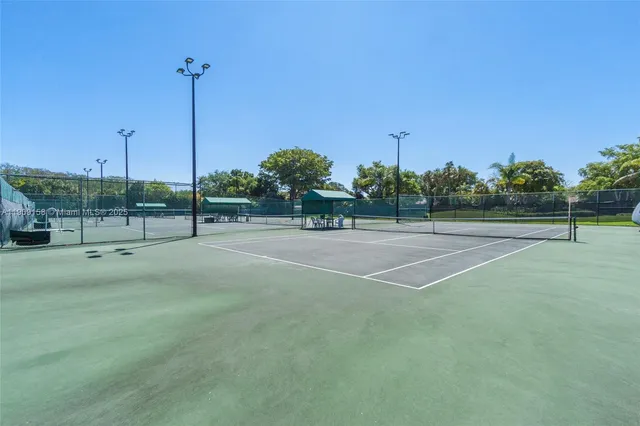 a front view of a house with a garden and plants