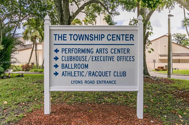 a view of a park with large trees