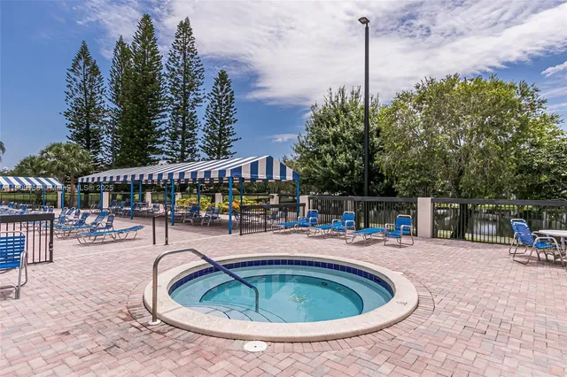 a balcony with chairs and table