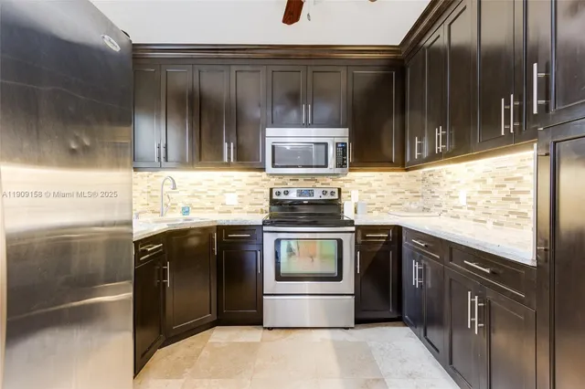 a view of a room with wooden floor and furniture