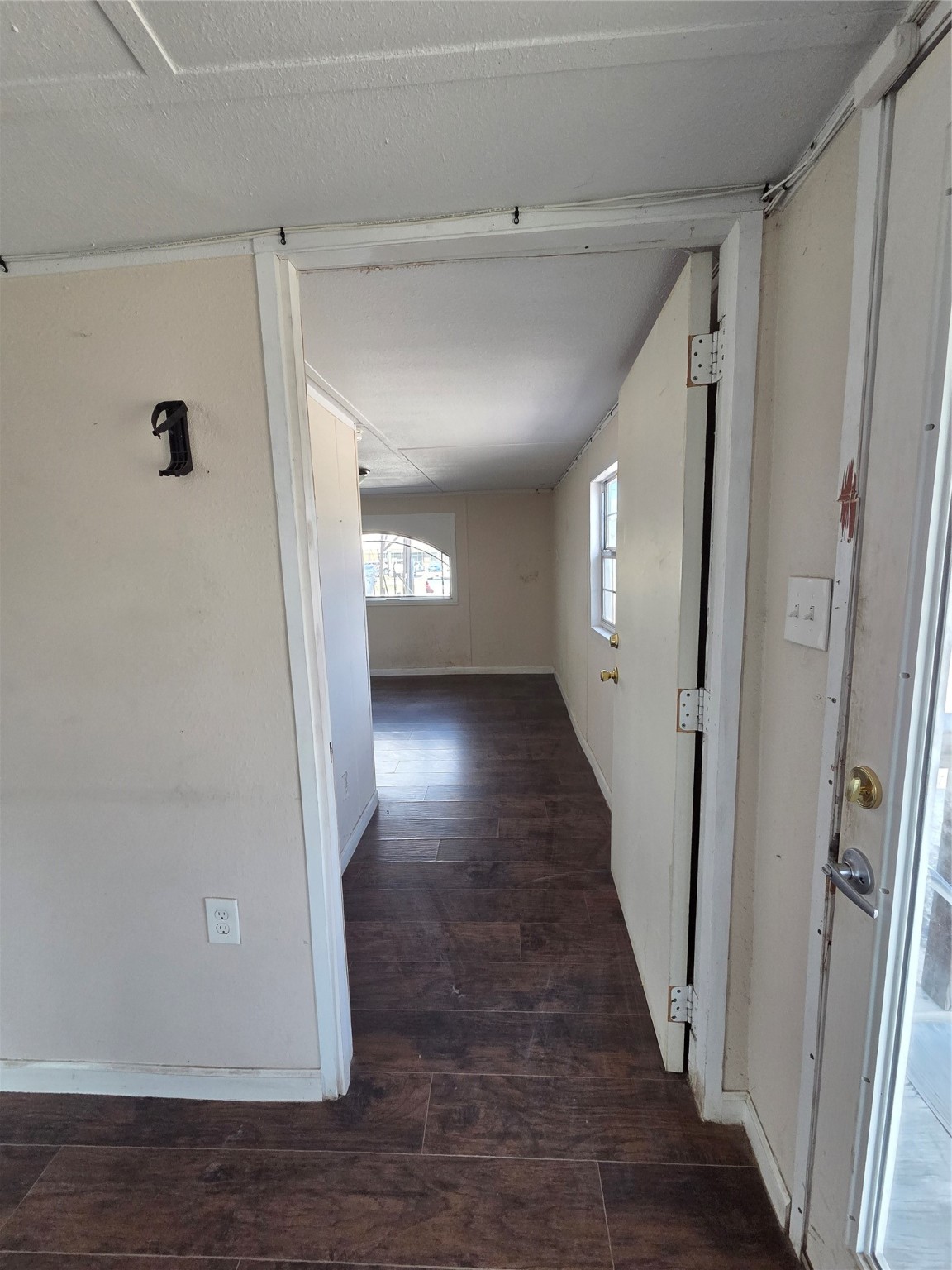 331 West Gulf Bank Road Houston, TX 77037 - Photo 3 of 7 a view of a hallway with wooden floor
