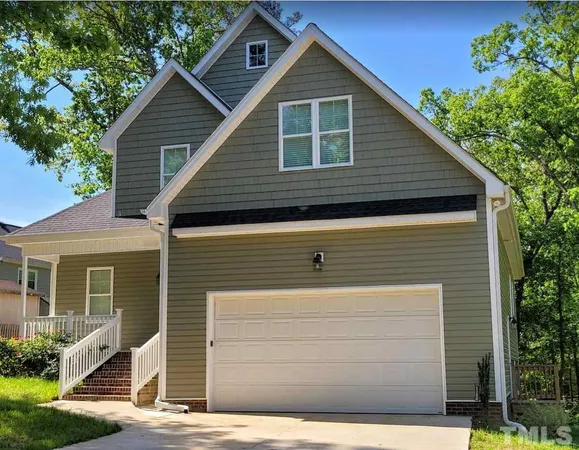 a front view of a house with garage