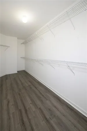 a white toilet sitting next to a shower