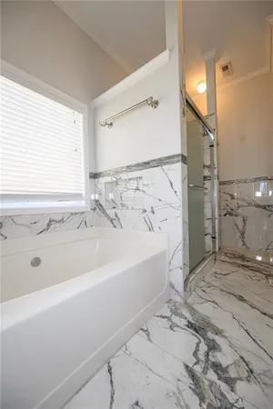 a bathroom with a sink vanity granite and a mirror