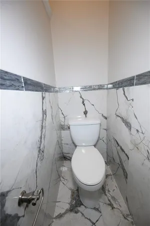 a bathroom with a bathtub and a window