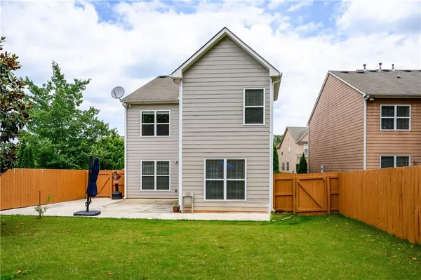 a view of a cars park in front of a building