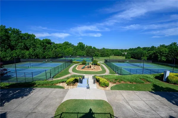an aerial view of a house with yard