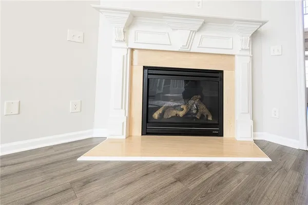 a view of a fireplace with wooden floor