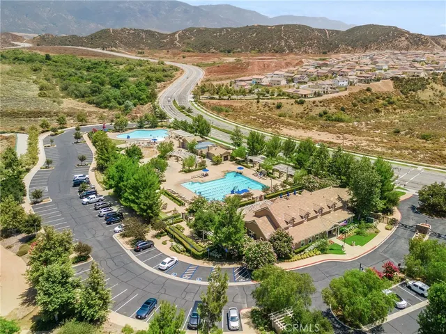 an aerial view of residential building with outdoor space and river