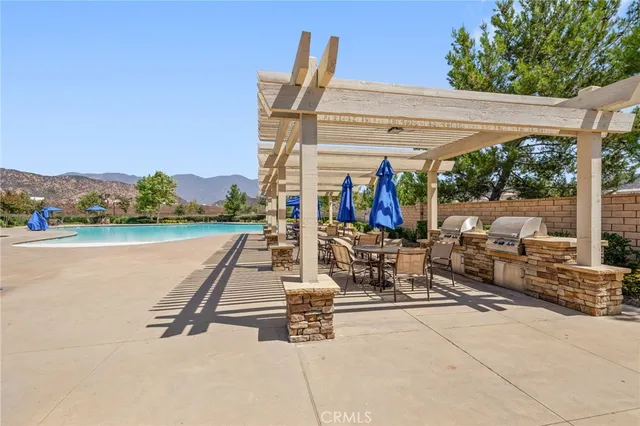 a view of a patio with a table and chairs